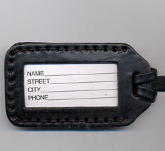 It Takes a Village leather luggage tag